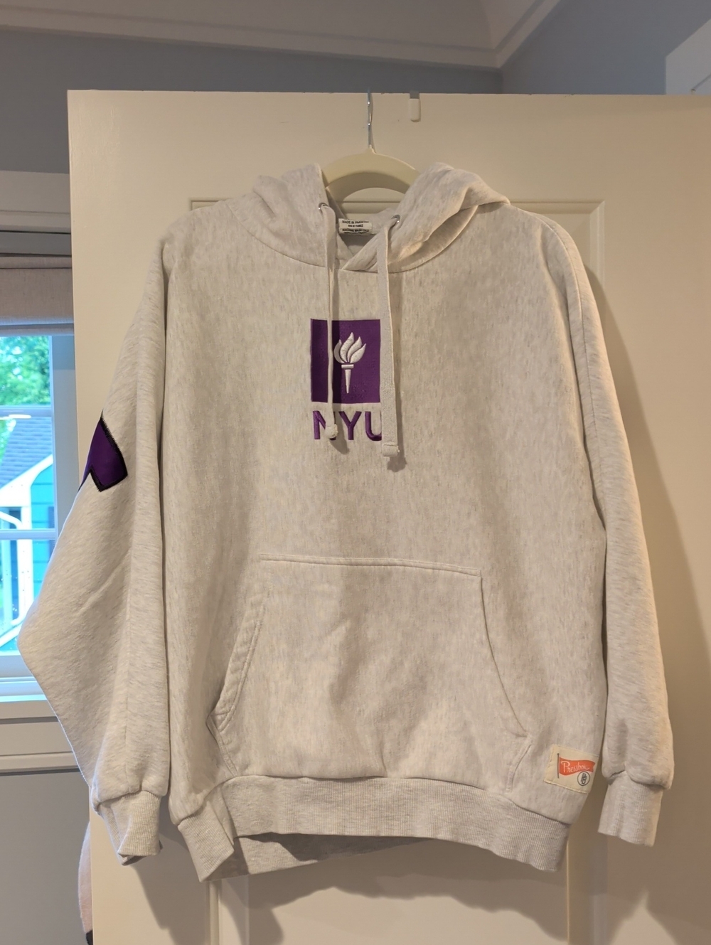 NYU Logo Pressbox Light Gray Crewneck Hoodie with Purple NYU Torch